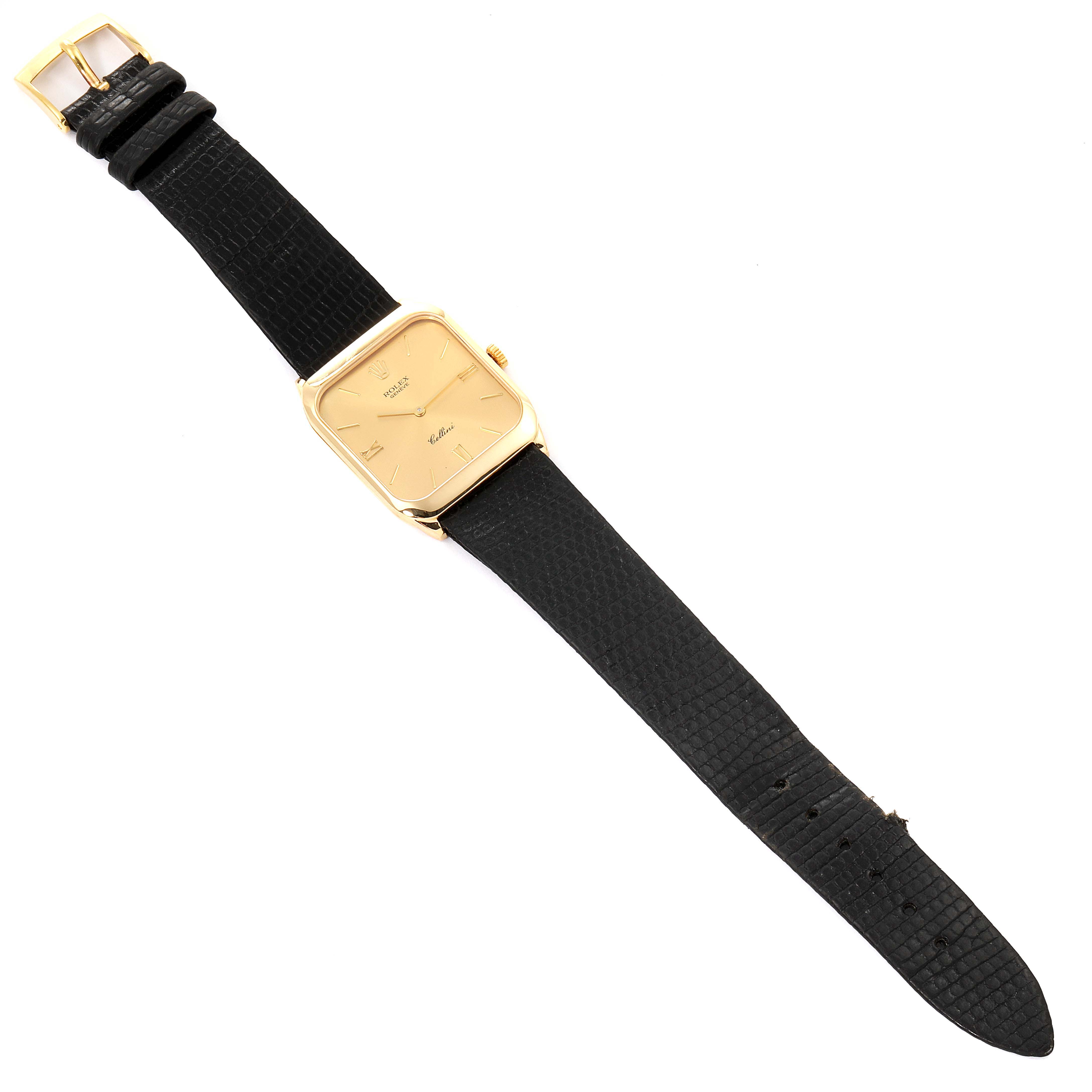 The image shows a full view of a Rolex Cellini 4135 Men's Yellow Gold Champagne Dial 4135 Men's Yellow Gold Champagne Dial watch with a black leather strap and a gold rectangular dial.