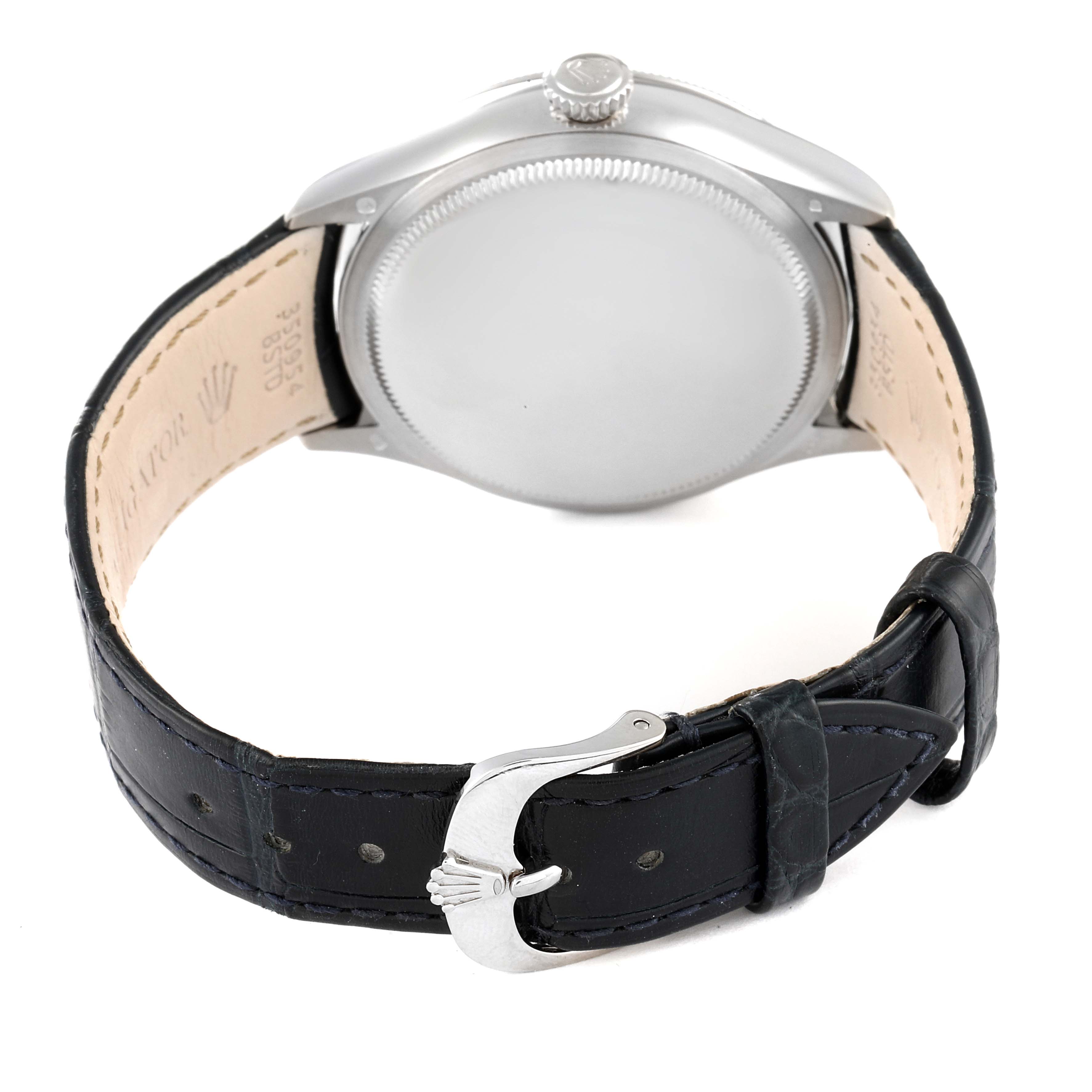 The image shows the back view of a Rolex Cellini 50519 Men's White Gold Blue Dial 50519 Men's White Gold Blue Dial watch, featuring its case back and leather strap with a buckle.