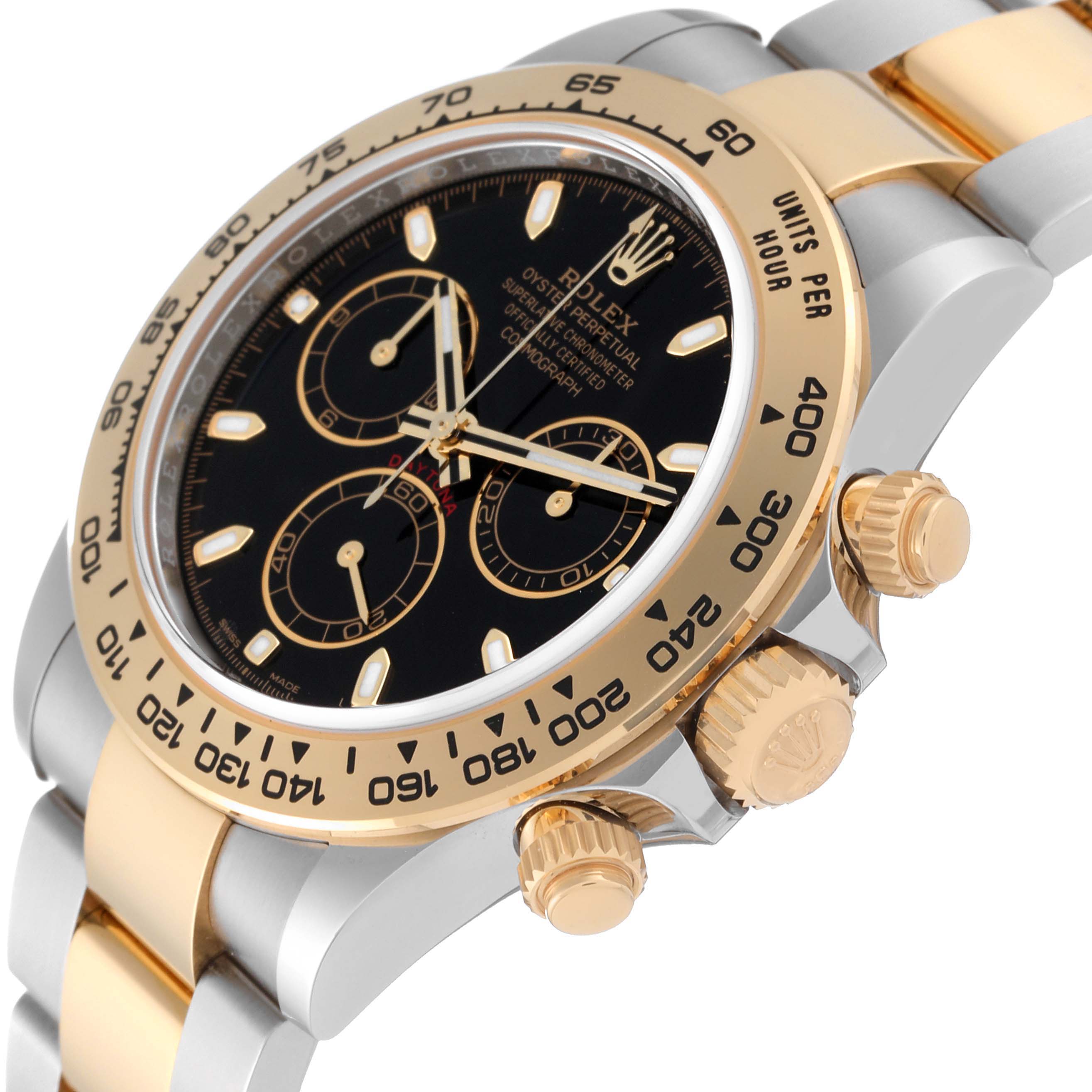 This image shows a side angle view of a Rolex Daytona 116503 Men
s Steel and Gold (two tone) Black Dial 116503 Men
s Steel and Gold (two tone) Black Dial watch, highlighting its bezel, crown, and subdials.