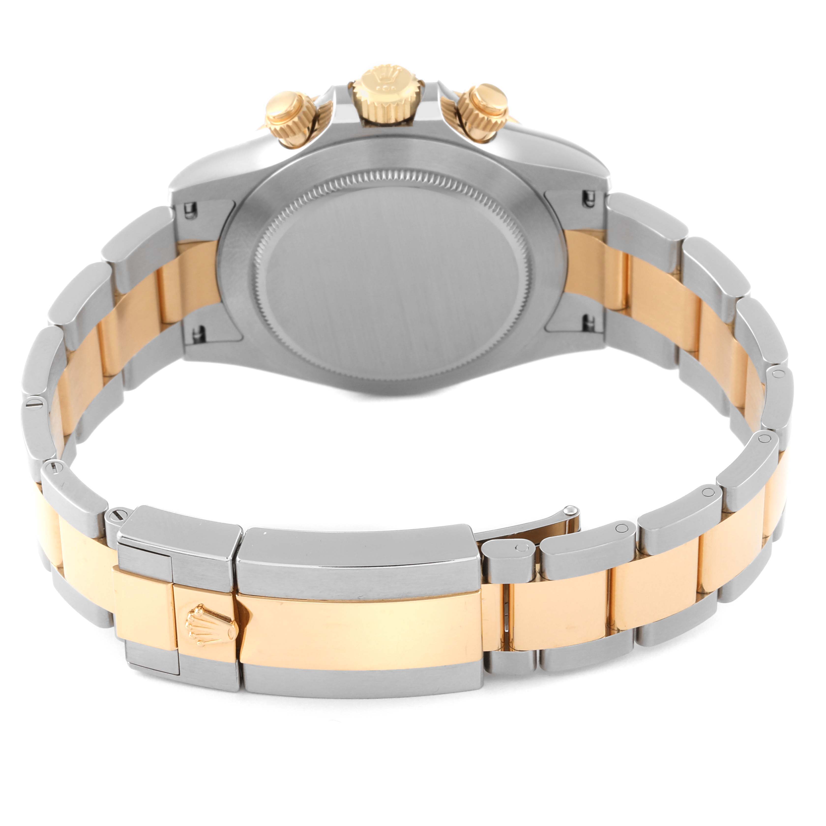 The image shows the back of the Rolex Daytona 116503 Men
s Steel and Gold (two tone) Black Dial 116503 Men
s Steel and Gold (two tone) Black Dial watch, highlighting the case, bracelet, and clasp in a two-tone design.