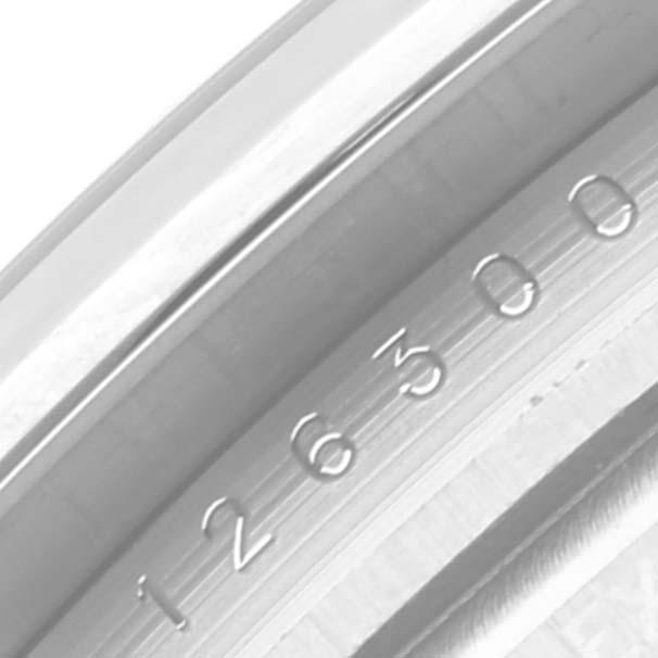 This image shows a close-up of the engraved serial number on the case edge of a Rolex Datejust 41 126300 Men
s Stainless Steel Blue Dial 126300 Men
s Stainless Steel Blue Dial watch.