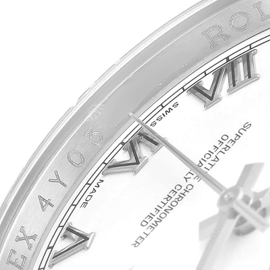 The image shows a close-up of the dial and bezel of a Rolex Datejust 116234 Men's Stainless Steel White Dial 116234 Men's Stainless Steel White Dial watch, focusing on the Roman numerals and part of the second hand.