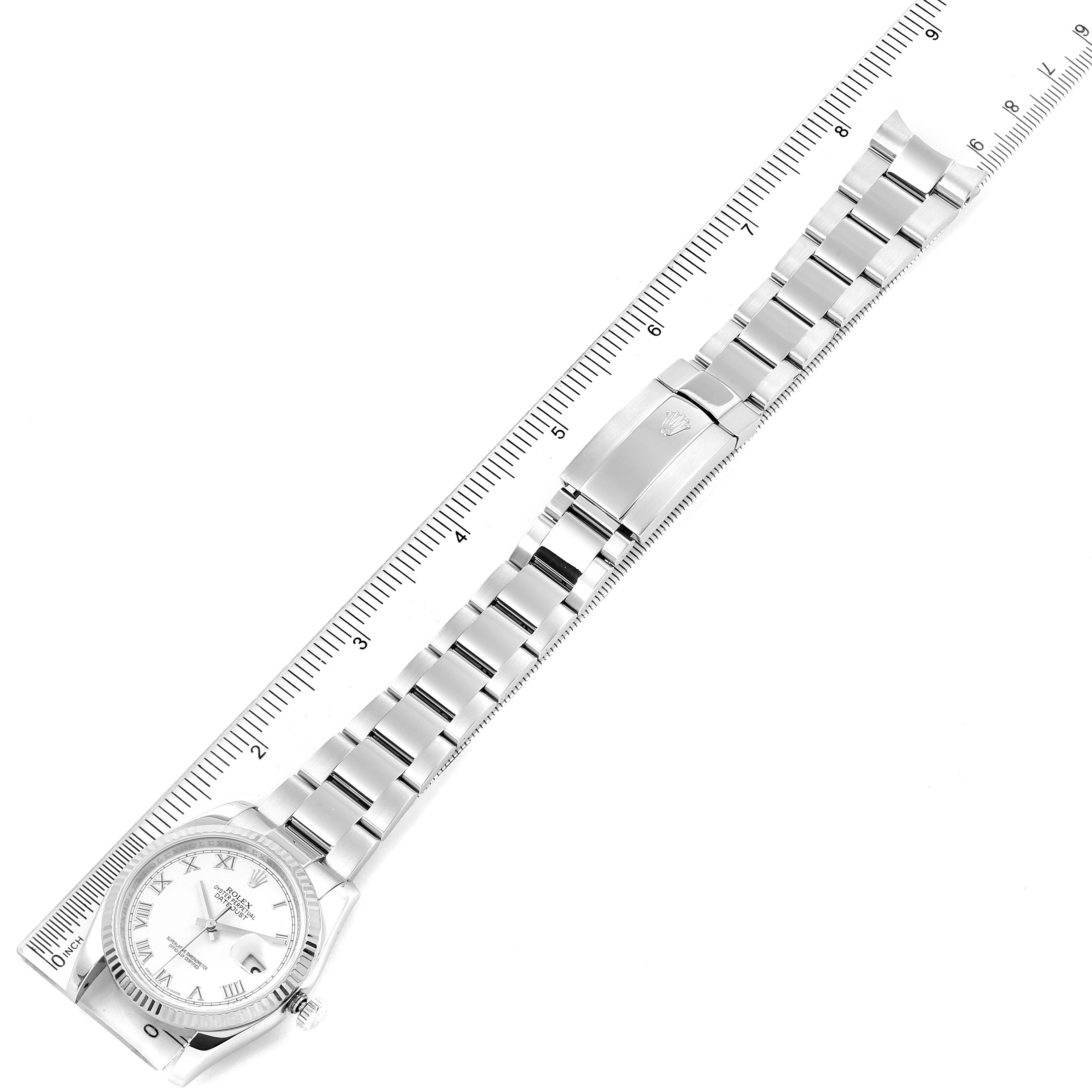 The image shows a top-down view of a Rolex Datejust 116234 Men's Stainless Steel White Dial 116234 Men's Stainless Steel White Dial watch, including the dial, bracelet, and clasp, placed alongside a ruler.