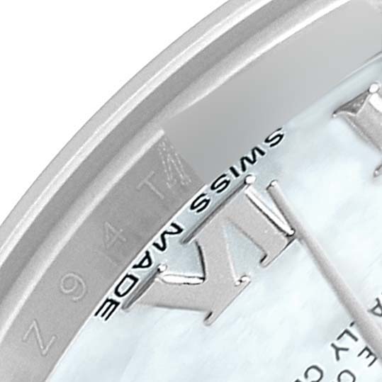 This close-up image shows the "Swiss Made" marking and part of the Roman numeral hour markers on the dial of a Rolex Datejust 179174 Women's Stainless Steel Mother of Pearl Dial 179174 Women's Stainless Steel Mother of Pearl Dial watch.