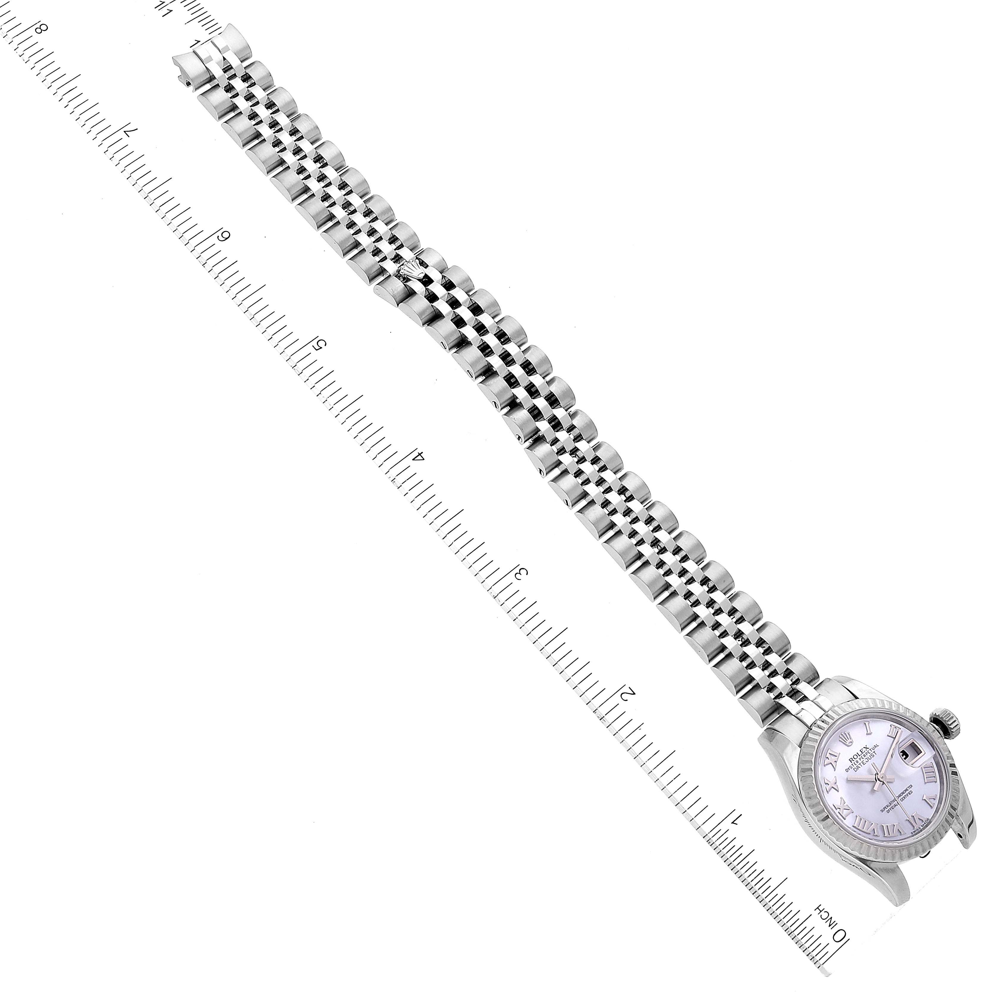 The image shows a full-length view of a Rolex Datejust 179174 Women's Stainless Steel Mother of Pearl Dial 179174 Women's Stainless Steel Mother of Pearl Dial watch, highlighting its bracelet and dial, placed alongside a ruler for scale.