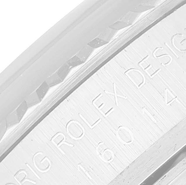 The image shows a close-up of the Rolex Datejust 16014 Men's Stainless Steel White Dial 16014 Men's Stainless Steel White Dial watch case with engraved text.