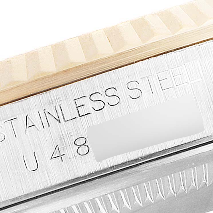 The image shows a close-up of the stainless steel case and the fluted bezel of a Rolex Datejust 16233 Men
s Steel and Gold (two tone) Mother of Pearl Dial 16233 Men
s Steel and Gold (two tone) Mother of Pearl Dial watch.