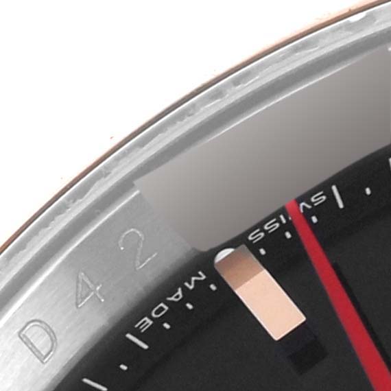 This close-up image shows the bezel and part of the dial of a Rolex Turn-o-Graph 116261 Men's Steel and Gold (two tone) Black Dial 116261 Men's Steel and Gold (two tone) Black Dial watch.