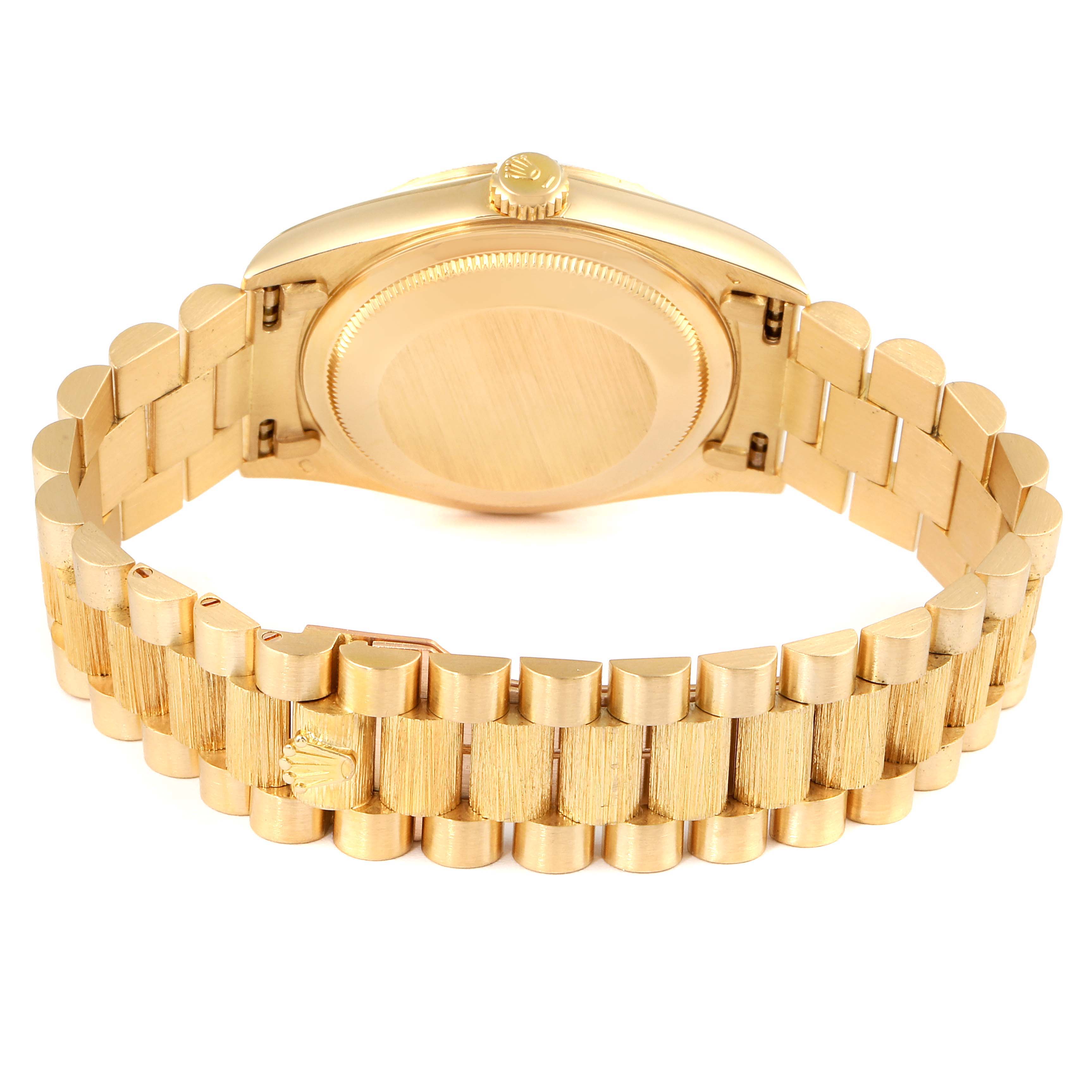 The image shows the back and bracelet of a Rolex President 1989-1990 Men
s Yellow Gold Champagne Dial 1989-1990 Men
s Yellow Gold Champagne Dial model watch, highlighting the clasp and case back.