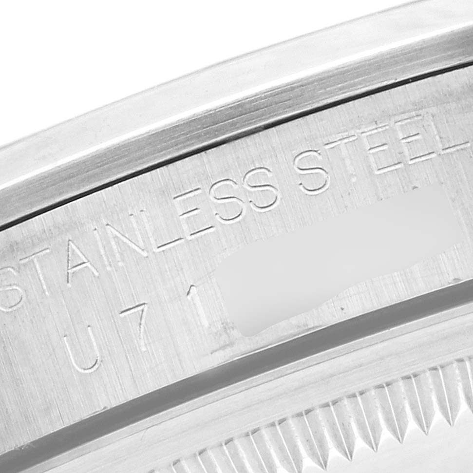 This is a close-up of the serial number engraving on the stainless steel case of a Rolex Explorer 14270 Men
s Stainless Steel Black Dial 14270 Men
s Stainless Steel Black Dial watch.