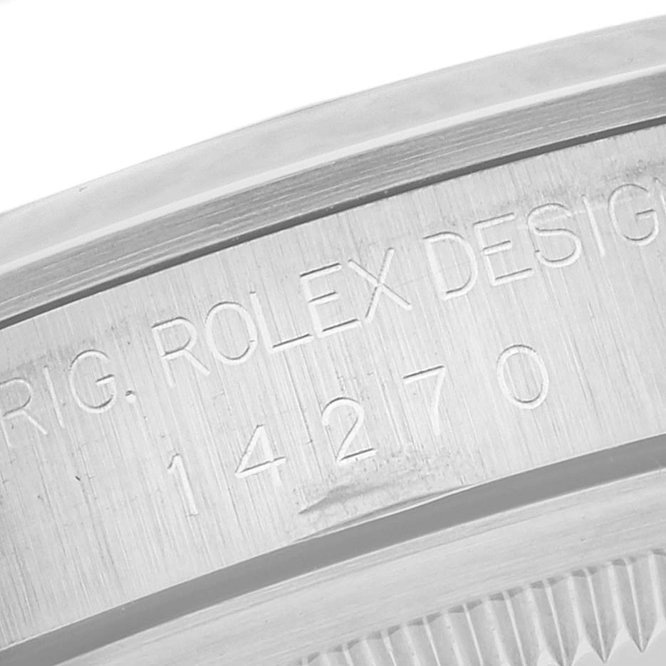The image shows a close-up view of the engraved design number on the case back edge of a Rolex Explorer 14270 Men
s Stainless Steel Black Dial 14270 Men
s Stainless Steel Black Dial watch.