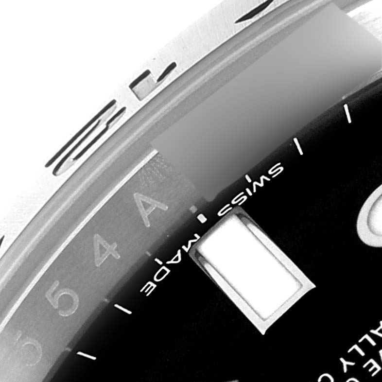 This close-up image shows part of the dial and bezel of a Rolex Explorer 216570 Men
s Stainless Steel Black Dial 216570 Men
s Stainless Steel Black Dial watch.