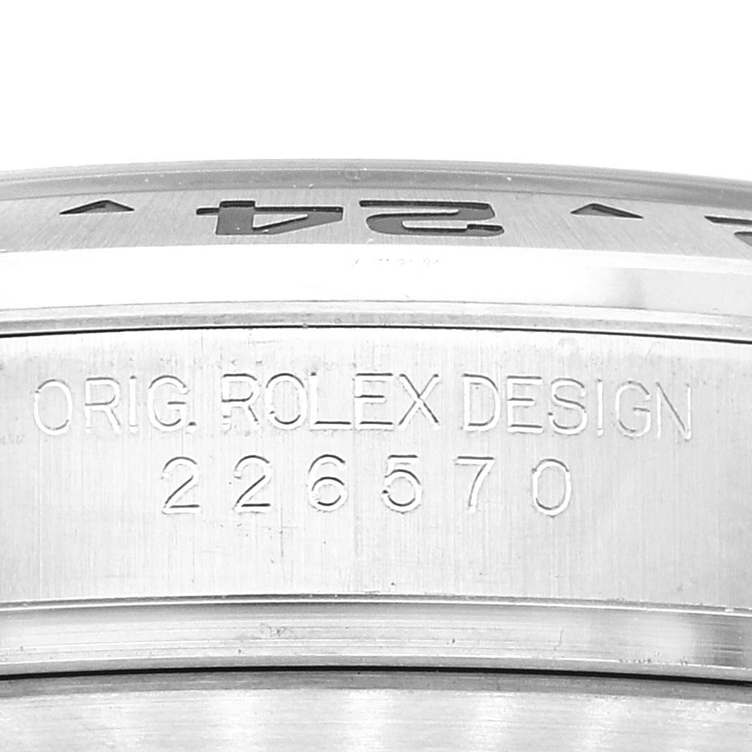 This close-up image shows the engraved bezel and case of a Rolex Explorer 226570 Men's Stainless Steel Black Dial 226570 Men's Stainless Steel Black Dial watch, including the model number 226570.