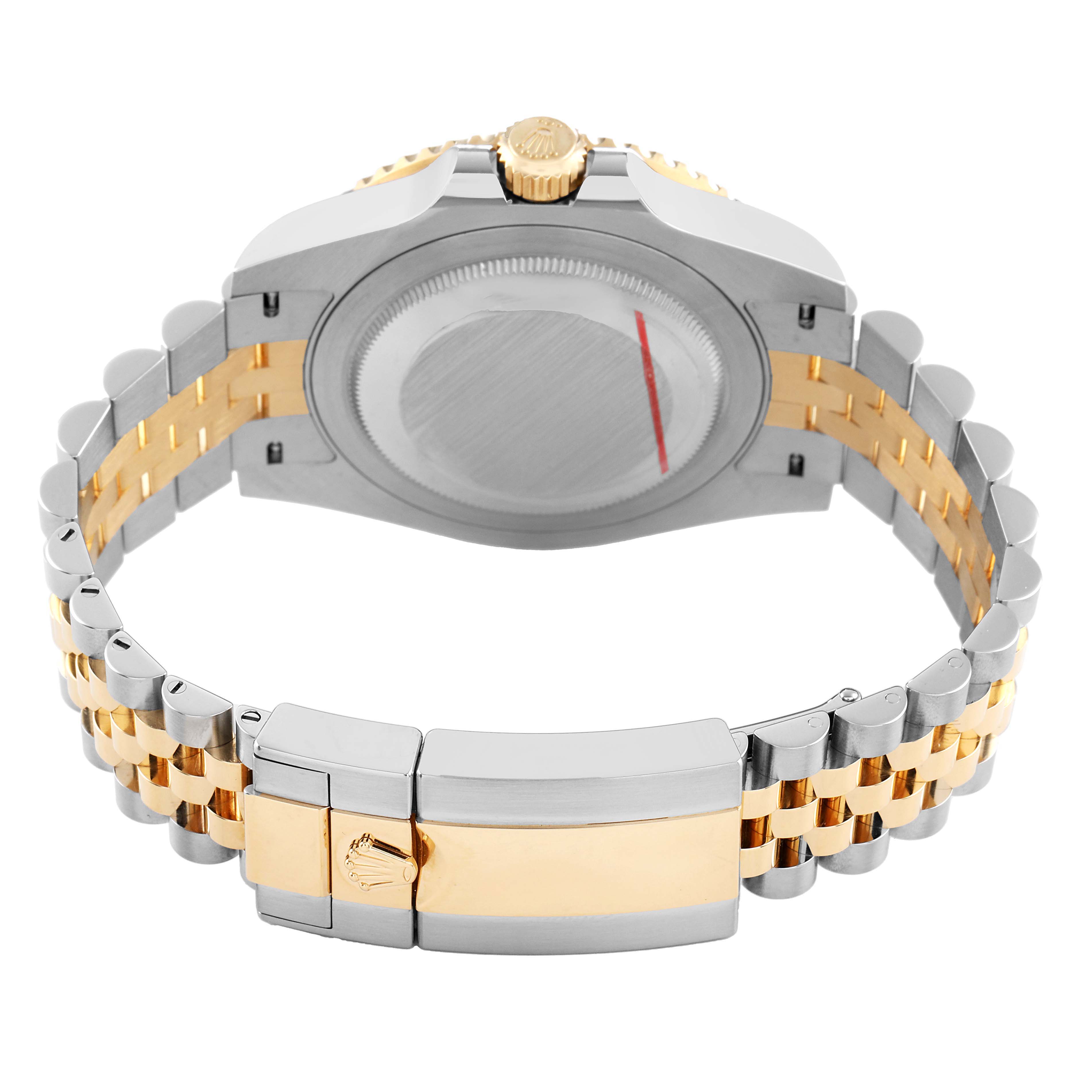 The image shows the back view of a Rolex GMT-Master 126713 Men's Steel and Gold (two tone) Black Dial, highlighting the case back, crown, and two-tone bracelet.