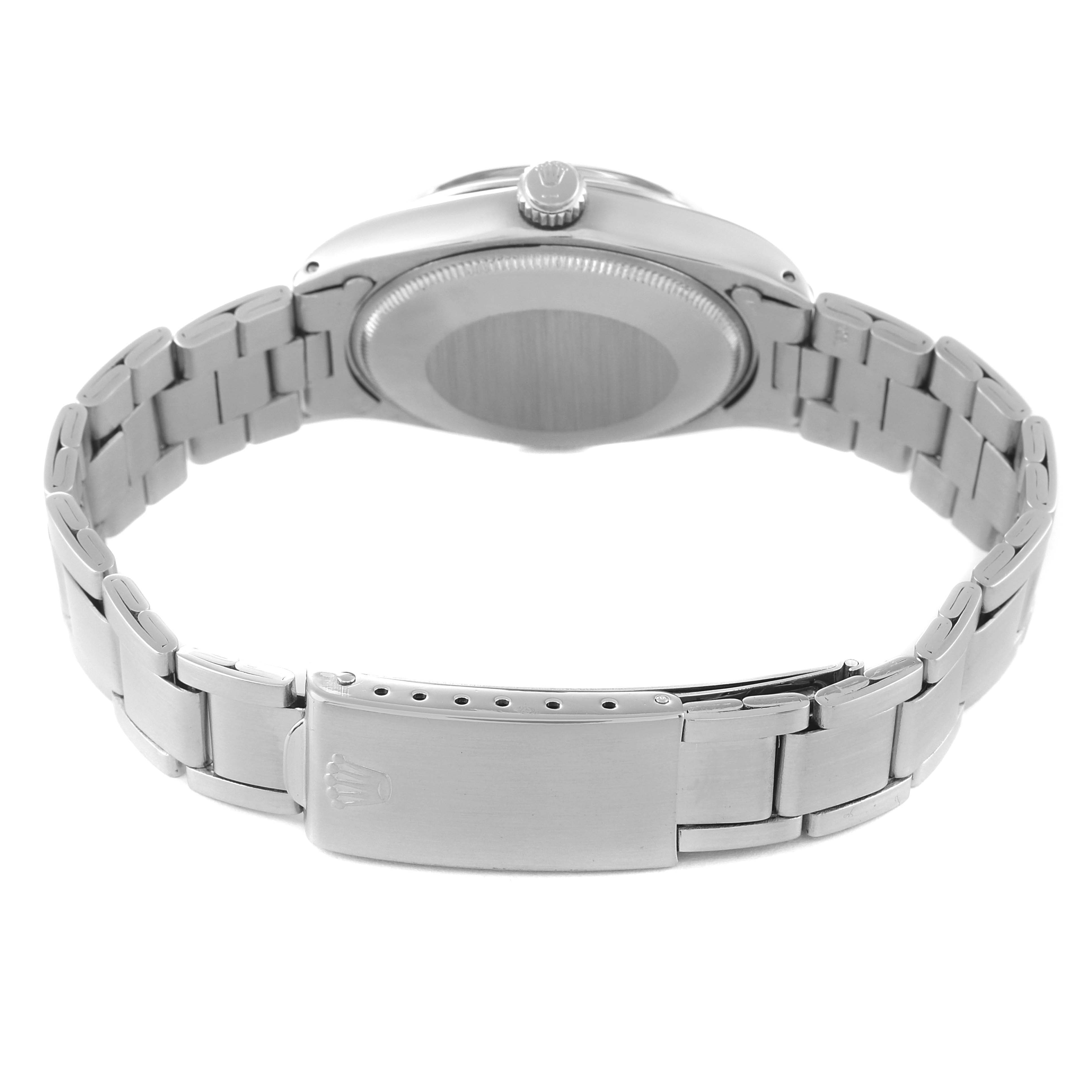The image shows the back view of a Rolex Oyster Perpetual 1002 Men's Stainless Steel Grey Dial 1002 Men's Stainless Steel Grey Dial watch, highlighting its bracelet and clasp.