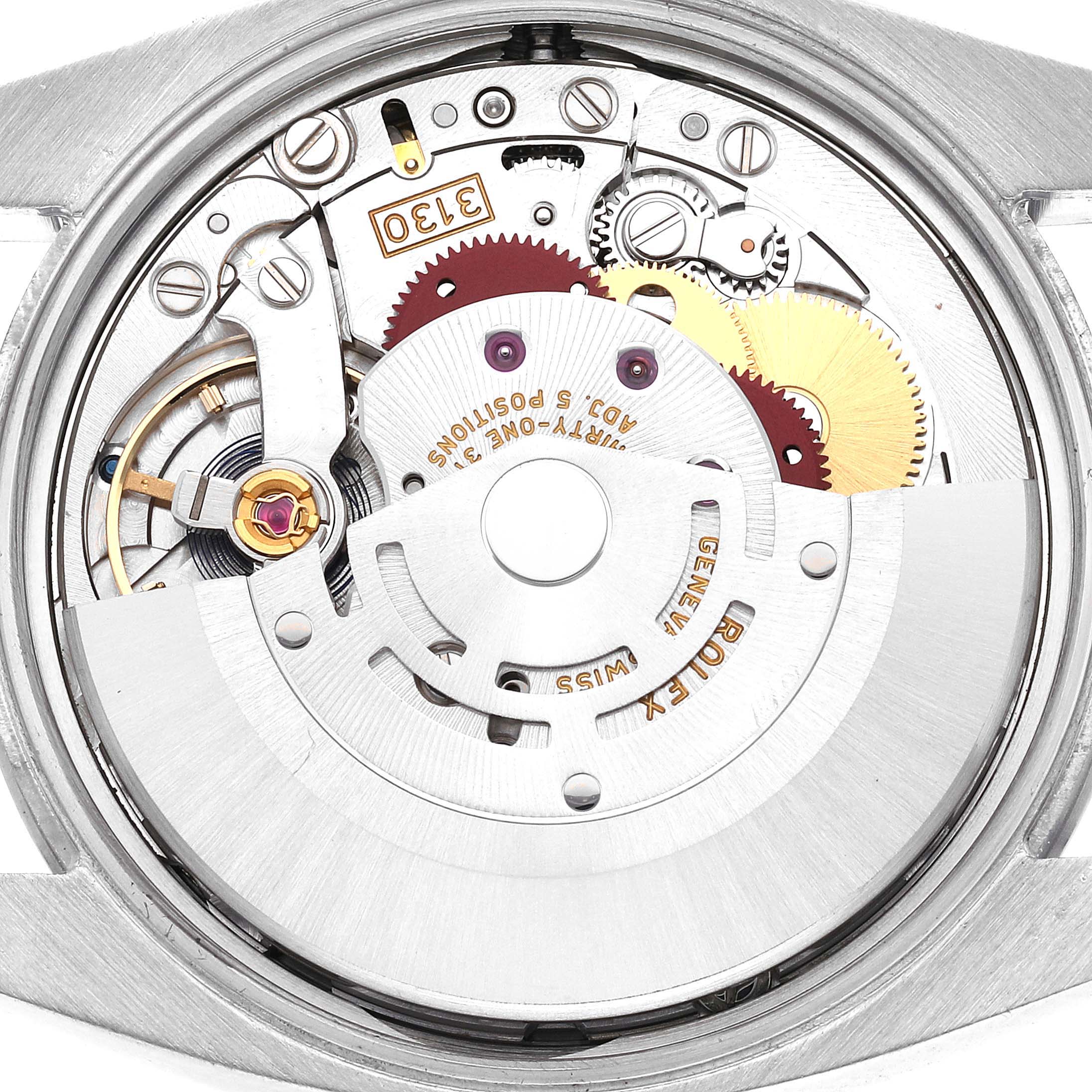 This image shows a close-up view of the movement mechanism of a Rolex Oyster Perpetual 114200 Men
s Stainless Steel Green Dial 114200 Men
s Stainless Steel Green Dial watch, highlighting its intricate gears and components.