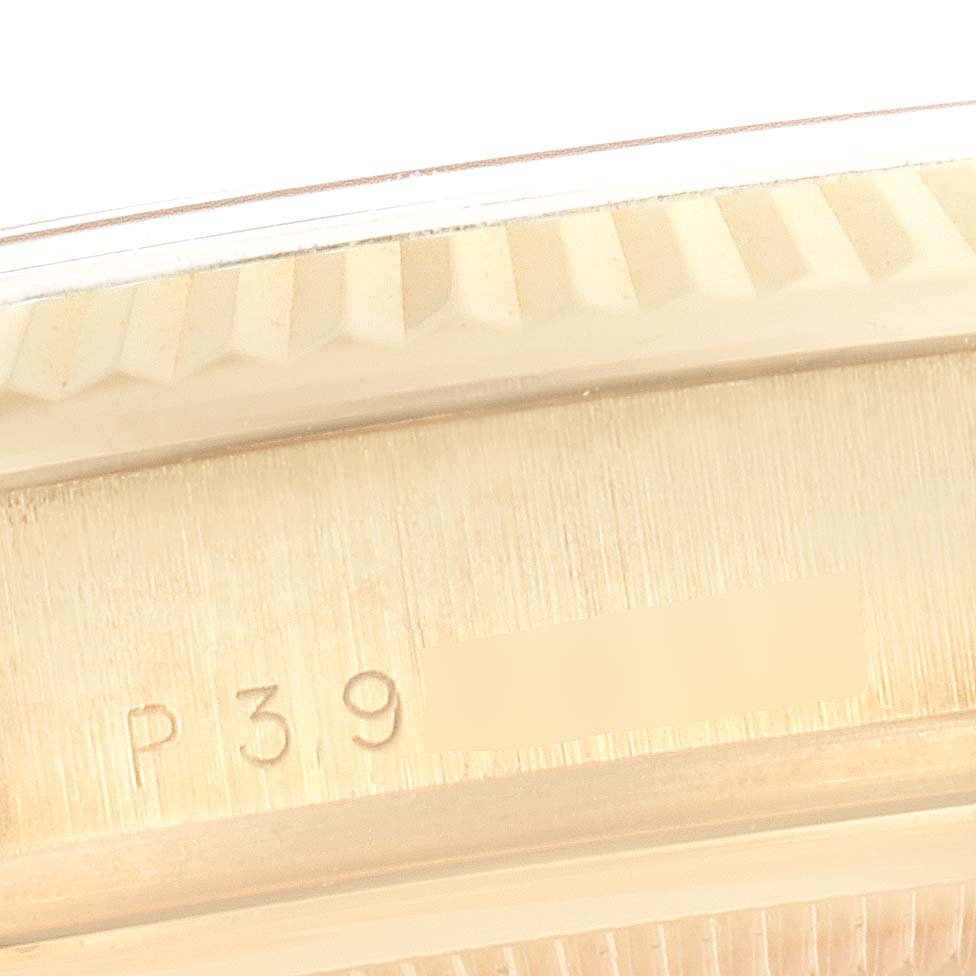 This close-up image shows the engraved side of the bezel on a Rolex President 118238 Men
s Yellow Gold Champagne Dial 118238 Men
s Yellow Gold Champagne Dial model watch.