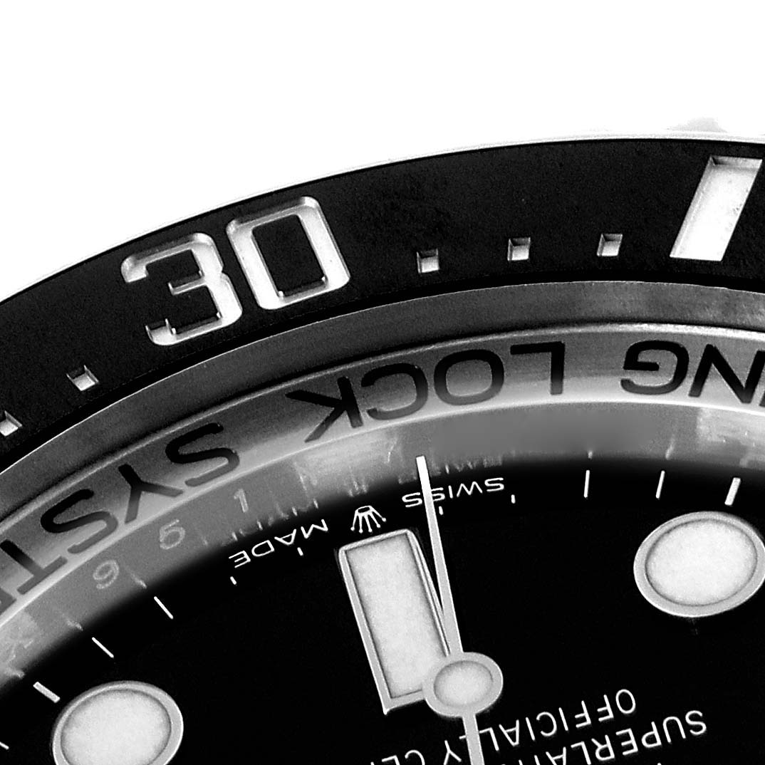 The image shows a close-up of the bezel and part of the dial of the Rolex Sea-Dweller 126660 Men's Stainless Steel Blue Dial 126660 Men's Stainless Steel Blue Dial watch at an angle.