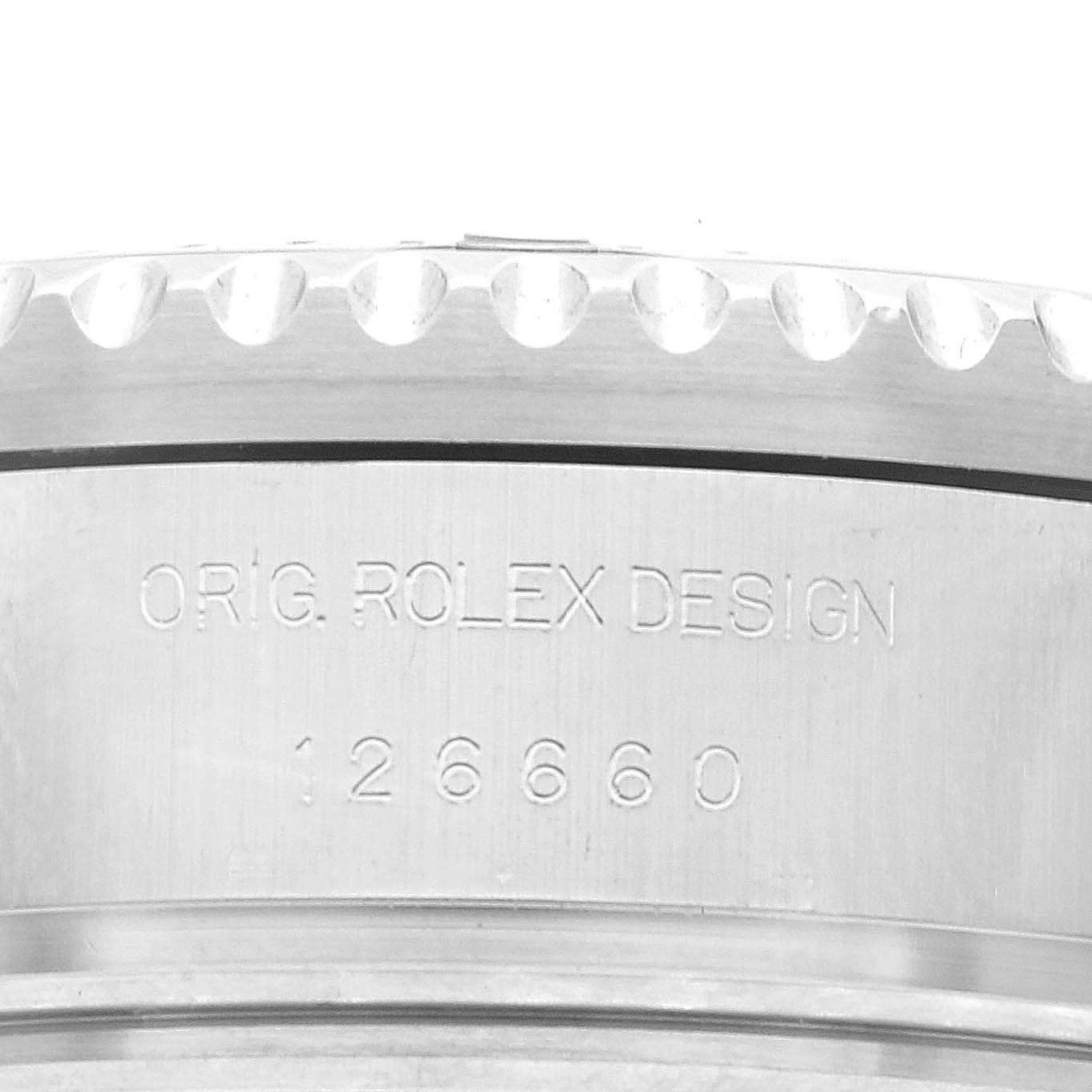 This image shows a close-up of the side of a Rolex Sea-Dweller 126660 Men's Stainless Steel Blue Dial 126660 Men's Stainless Steel Blue Dial watch case, featuring the engraved model number and "Orig. Rolex Design."