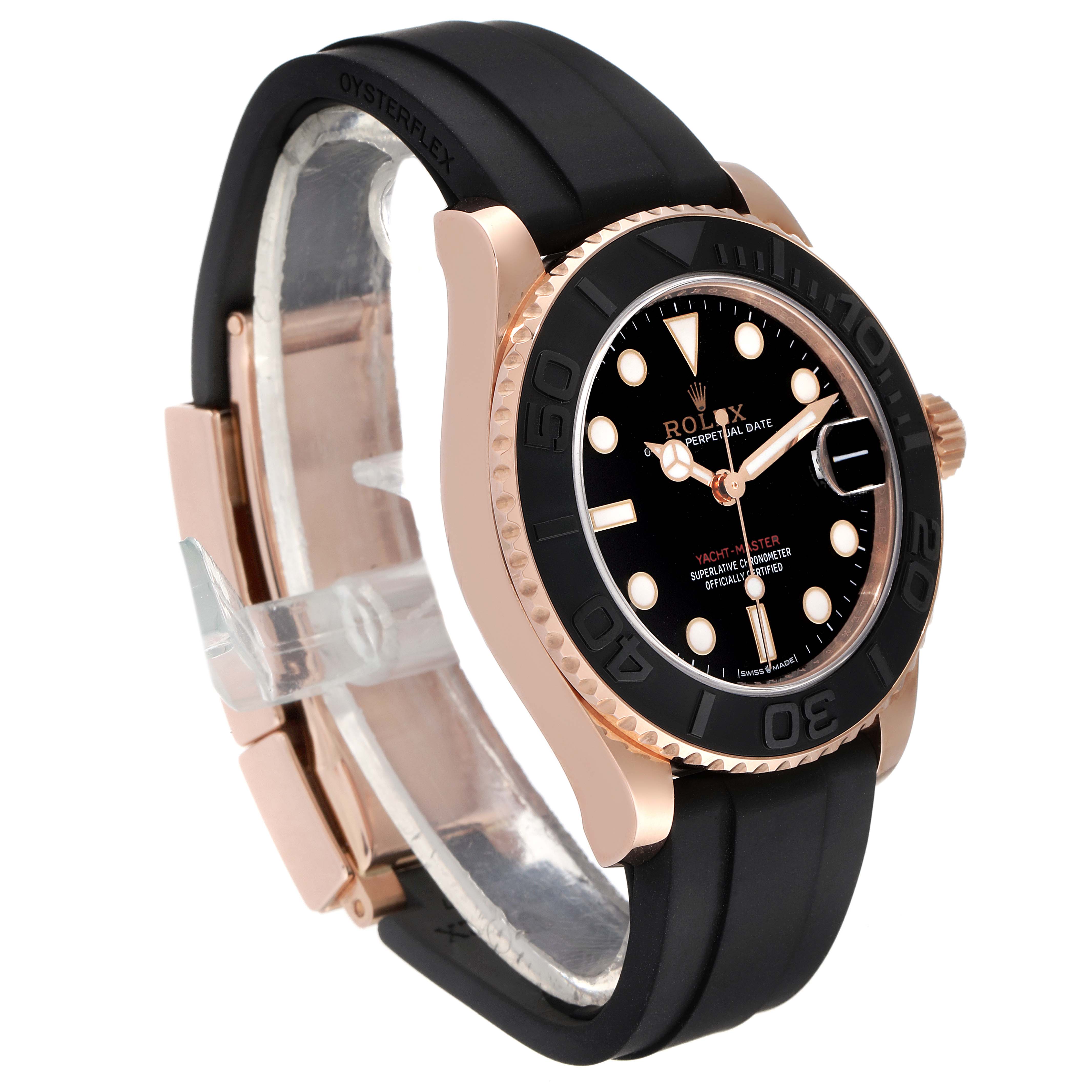 The Rolex Yacht-Master 268655 Men's Rose Gold Black Dial 268655 Men's Rose Gold Black Dial watch is shown at a 3/4 angle, highlighting its black dial, rose gold case, and black rubber strap.