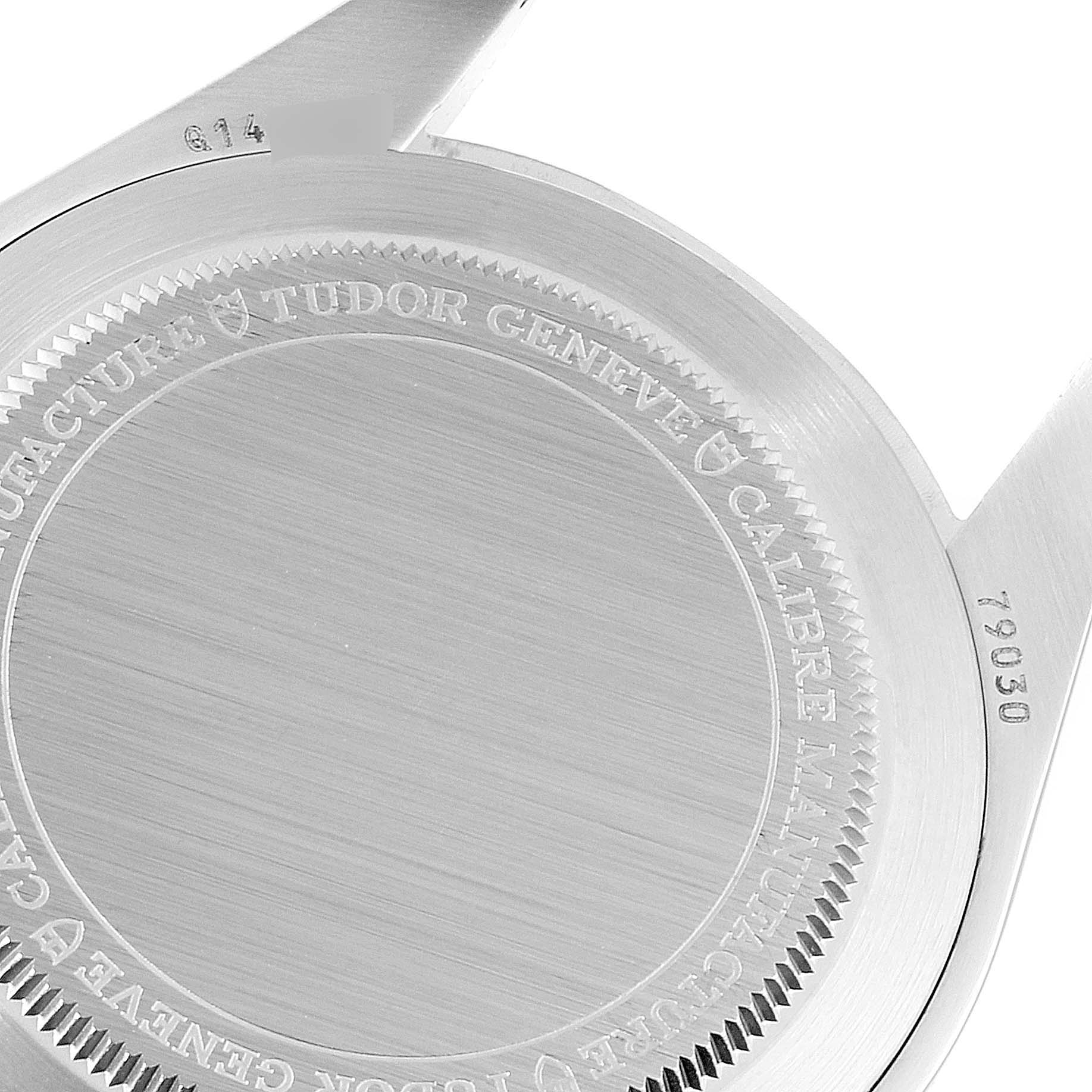 The image shows the back case of a Tudor Heritage Black Bay 79030N Men
s Stainless Steel Black Dial 79030N Men
s Stainless Steel Black Dial watch, displaying engraved details and part of the case lugs.