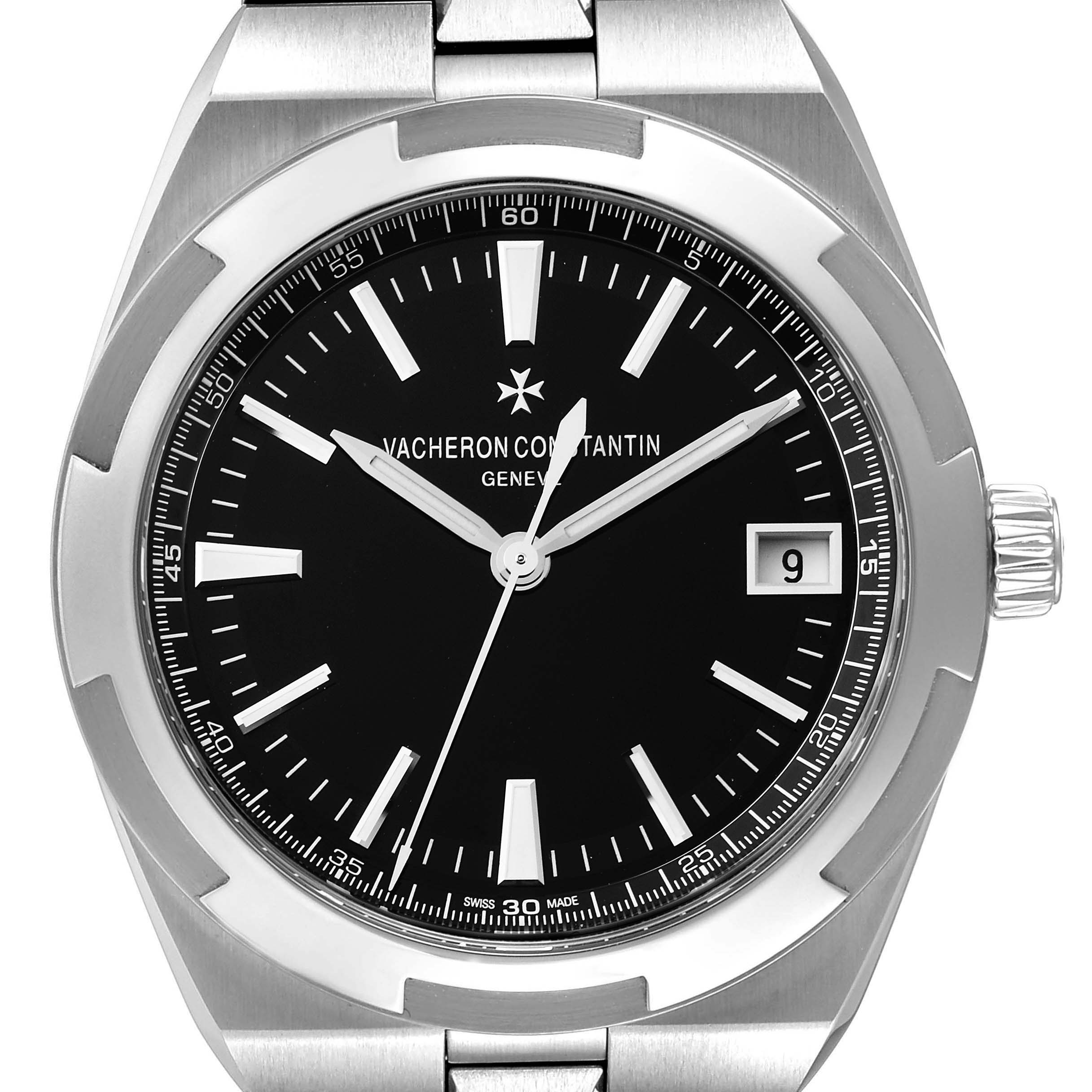 The Vacheron Constantin Overseas 4500V/110A Men's Stainless Steel Black Dial 4500V/110A Men's Stainless Steel Black Dial model watch is shown from a front angle, displaying the black dial, hour markers, date window, and part of the metal bracelet.