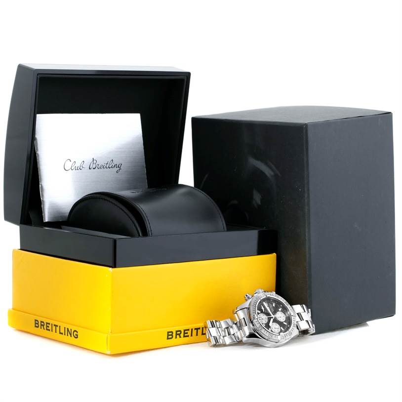 The Breitling Superocean A13340 Men's Stainless Steel Grey Dial A13340 Men's Stainless Steel Grey Dial watch is shown from an oblique angle alongside its box, leather case, and Club Breitling booklet.