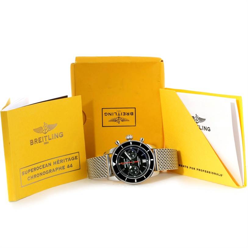 The Breitling Superocean A23370 Men's Stainless Steel Black Dial A23370 Men's Stainless Steel Black Dial watch is shown from the front, alongside its yellow branded boxes and manuals.