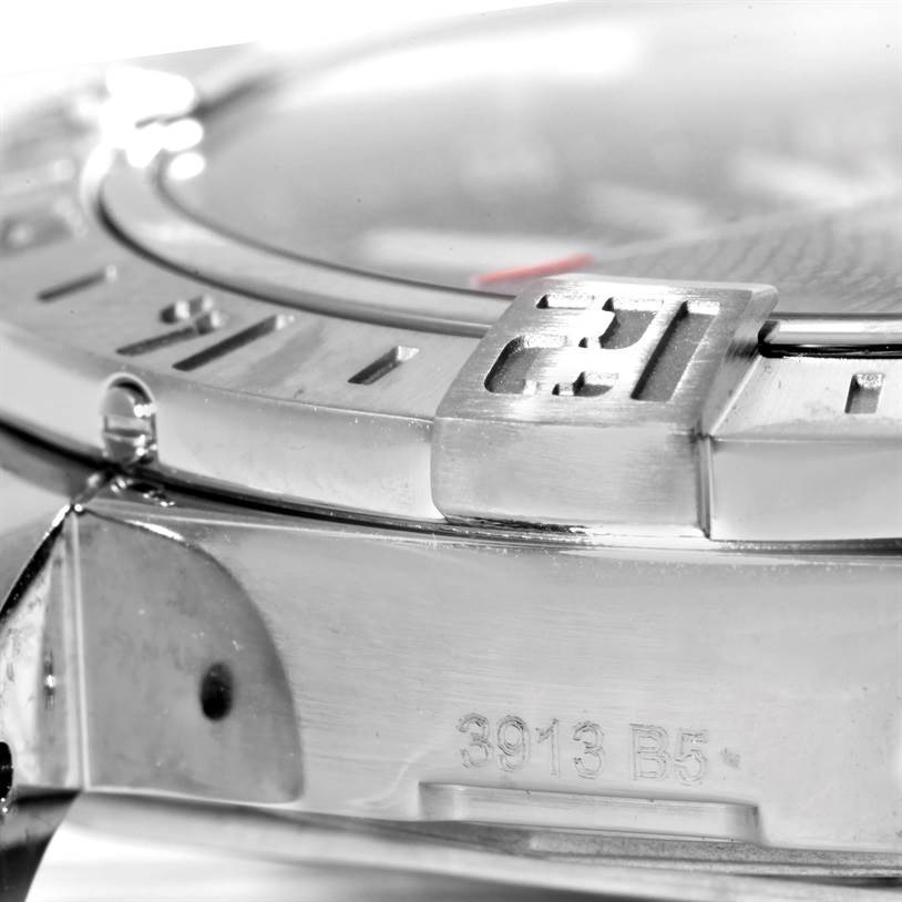 The image shows a close-up of the bezel and the side engraving on a Breitling Avenger A32390 Men's Stainless Steel Black Dial A32390 Men's Stainless Steel Black Dial watch.