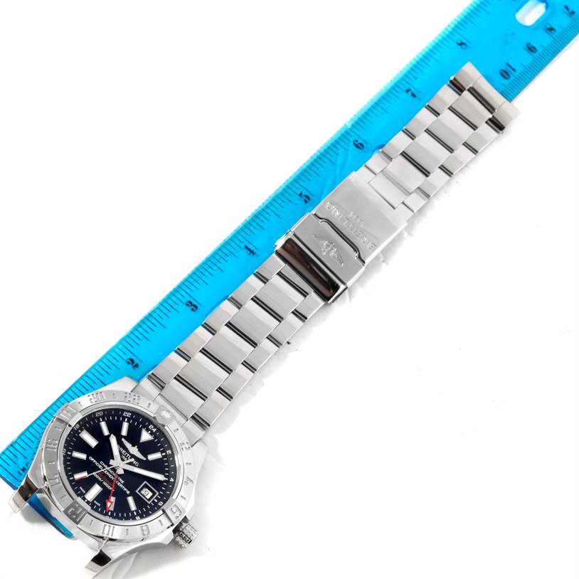 The Breitling Avenger A32390 Men's Stainless Steel Black Dial A32390 Men's Stainless Steel Black Dial watch is displayed flat with a ruler for scale, showing the face and metal bracelet.