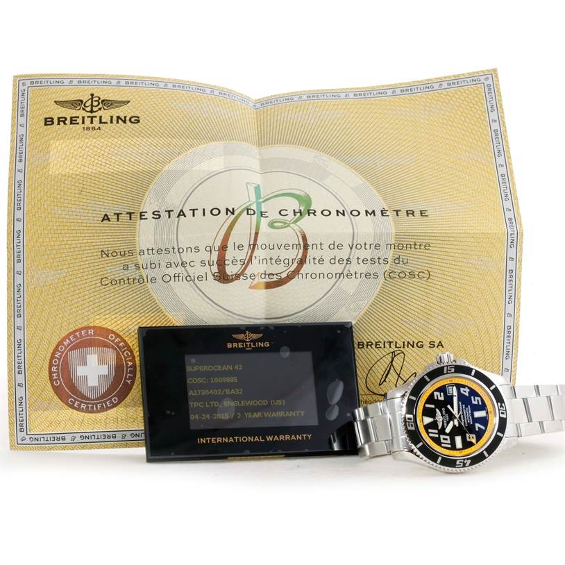 The image shows a Breitling Superocean A17364 Men's Stainless Steel Black Dial A17364 Men's Stainless Steel Black Dial watch with its certificate of chronometer attestation and international warranty card.