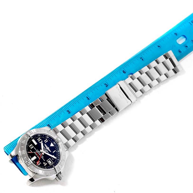 The image shows a Breitling Avenger A32390 Men's Stainless Steel Black Dial A32390 Men's Stainless Steel Black Dial watch from a top-down angle, placed next to a blue ruler for scale.