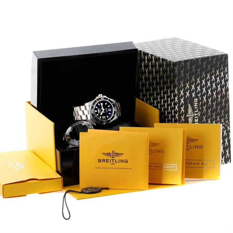 The Breitling Superocean A17391 Men's Stainless Steel Black Dial A17391 Men's Stainless Steel Black Dial watch is displayed at an angle showing its face and strap, along with the box and warranty booklets.