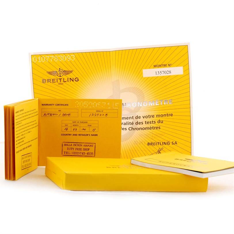 The image shows the warranty card, manual, and packaging for the Breitling Superocean A17364 Men's Stainless Steel Black Dial A17364 Men's Stainless Steel Black Dial watch.