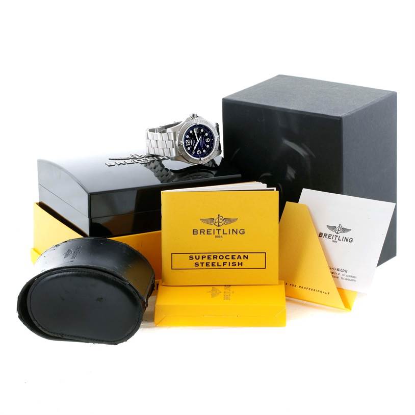 The image shows a Breitling Superocean A17390 Men's Stainless Steel Black Dial A17390 Men's Stainless Steel Black Dial model watch angled slightly to the right with its box, owner's manual, and accessories.