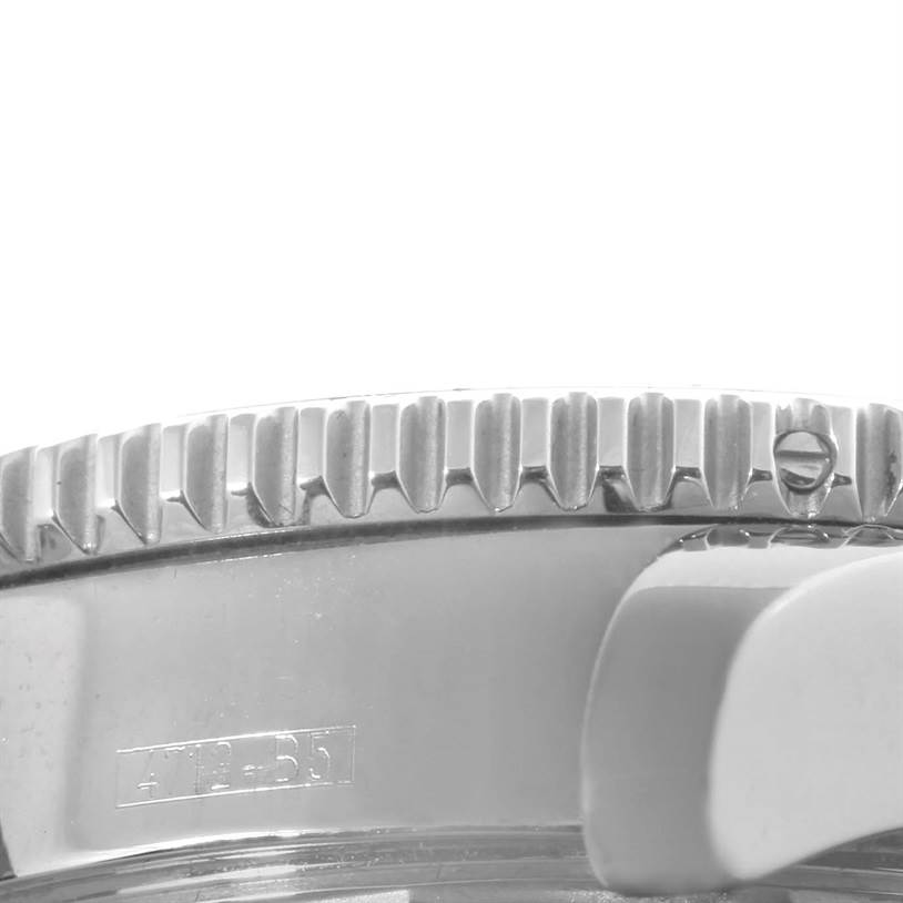 The image shows a close-up of the bezel and part of the case of a Breitling Superocean A17364 Men's Stainless Steel Black Dial A17364 Men's Stainless Steel Black Dial watch.