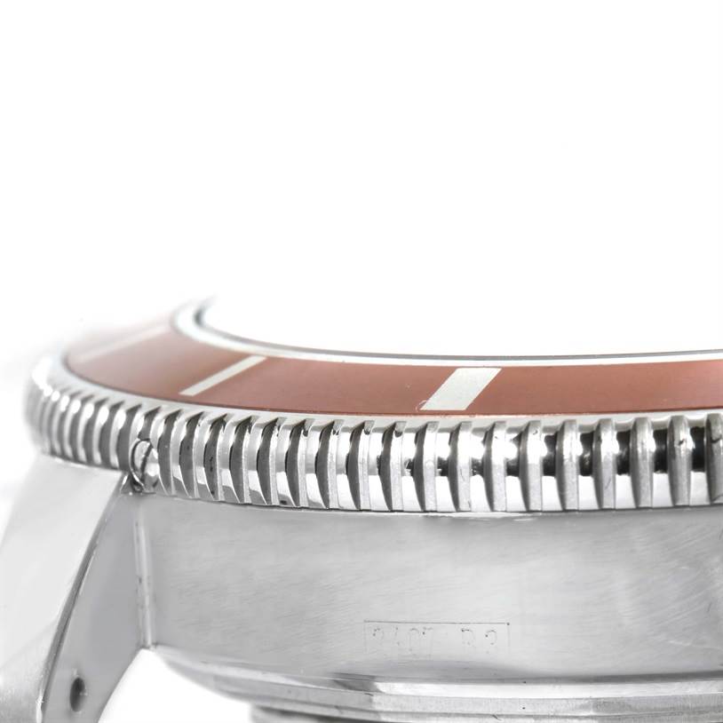 The image shows a close-up side view of the bezel and case of a Breitling Superocean A17320 Men
s Stainless Steel Brown Dial A17320 Men
s Stainless Steel Brown Dial watch.