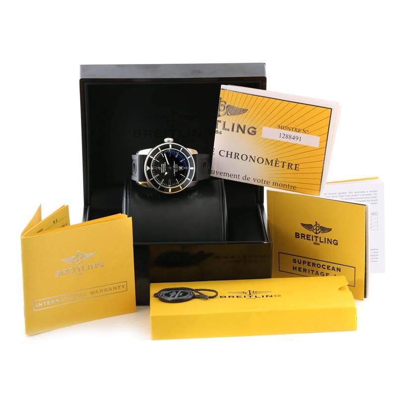 The Breitling Superocean A17320 Men's Stainless Steel Black Dial A17320 Men's Stainless Steel Black Dial watch is displayed in its box at a front angle along with warranty and instructional booklets.