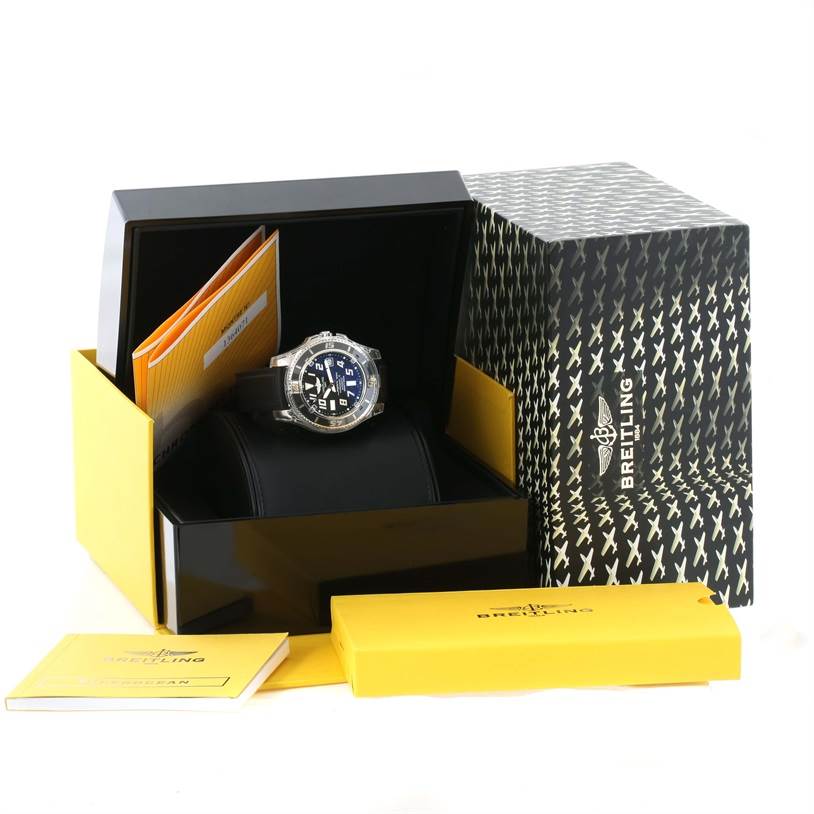 The Breitling Superocean A17364 Men
s Stainless Steel Black Dial A17364 Men
s Stainless Steel Black Dial watch is shown at an angle inside its open box, with booklets and packaging visible.