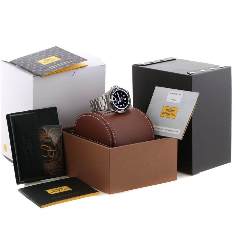 The Breitling Superocean A17391 Men's Stainless Steel Black Dial A17391 Men's Stainless Steel Black Dial watch is displayed from the front on a leather cushion, alongside its box, warranty card, and manual.
