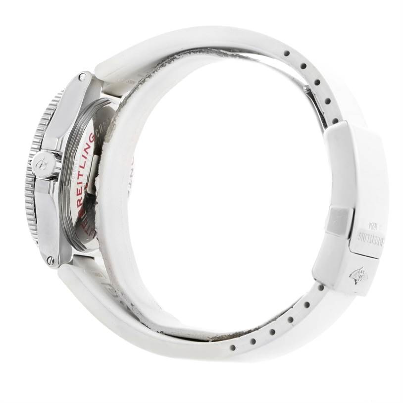 The image shows the side view of a Breitling Superocean A32380A9-A737 Stainless Steel White Dial A32380A9-A737 Stainless Steel White Dial watch, highlighting the crown, bezel, and part of the white strap.