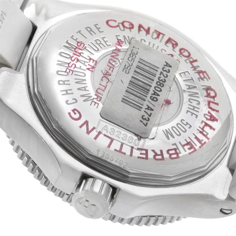 The image shows the back case, crown, and part of the band of a Breitling Superocean A32380A9-A737 Stainless Steel White Dial A32380A9-A737 Stainless Steel White Dial watch, emphasizing the serial number and inscriptions.