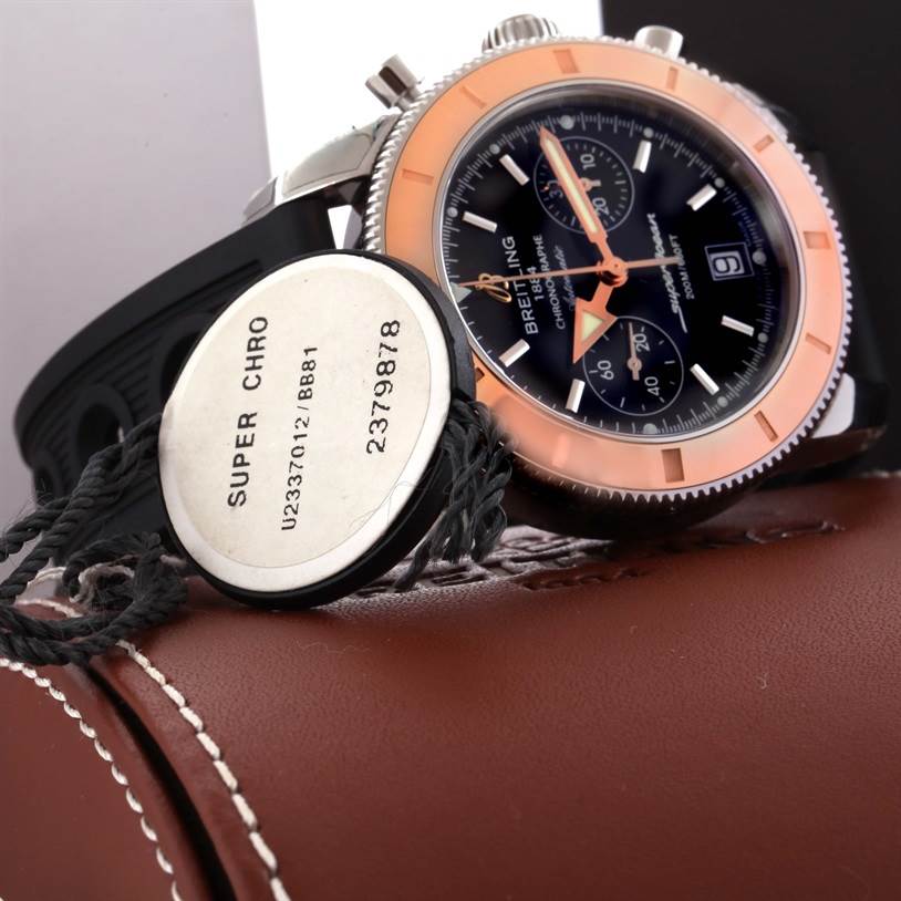 The image shows the Breitling Superocean U2337012/BB81-200S Men's Stainless Steel Black Dial U2337012/BB81-200S Men's Stainless Steel Black Dial watch from a side angle with a visible dial and tag.