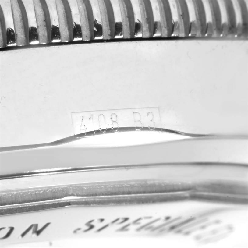 The image shows a close-up of the case and bezel of a Breitling Superocean A17320 Men
s Stainless Steel Blue Dial A17320 Men
s Stainless Steel Blue Dial watch, highlighting its serial number.