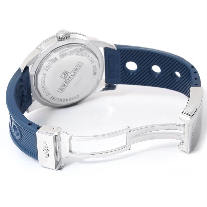 The image shows the backside of a Breitling Superocean A17320 Men
s Stainless Steel Blue Dial A17320 Men
s Stainless Steel Blue Dial watch, highlighting the case back and part of the blue rubber strap with the clasp.