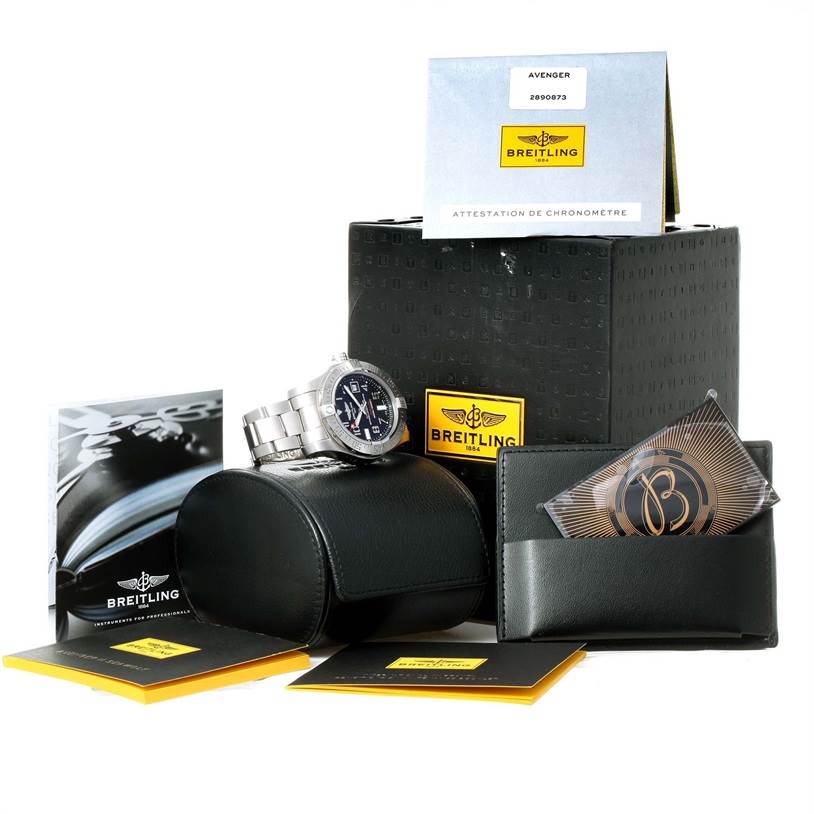 The image shows a Breitling Avenger A17331 Men's Stainless Steel Black Dial A17331 Men's Stainless Steel Black Dial watch at an angle, with its box, case, manual, and other accessories.