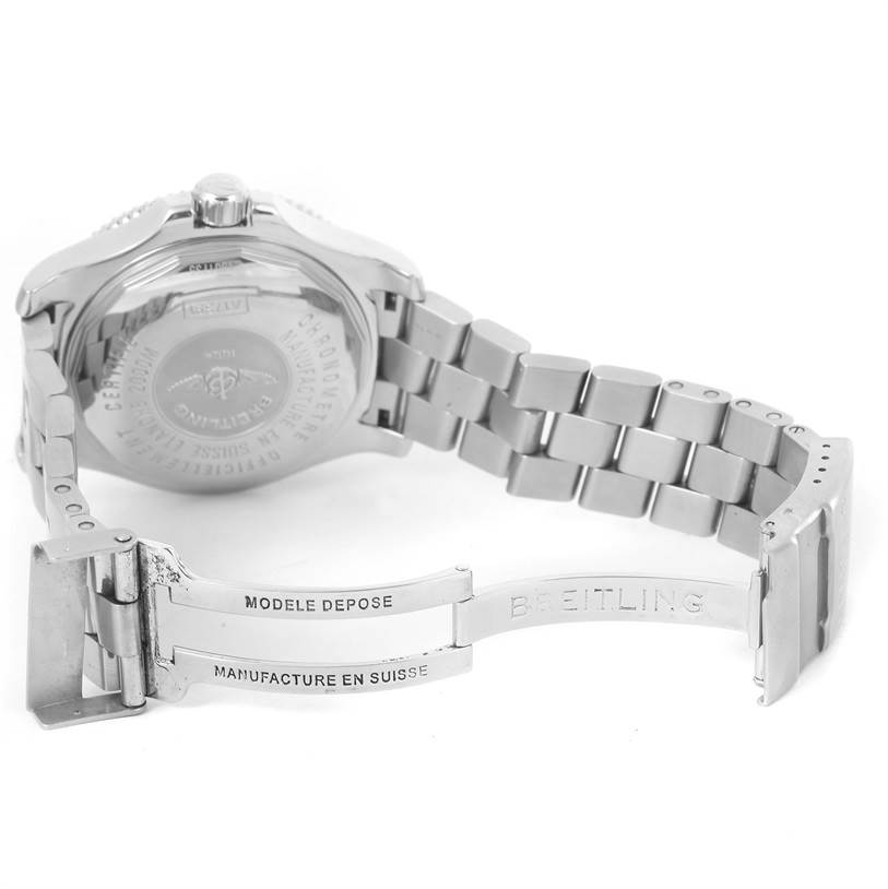 The image shows the backside and open clasp of a Breitling Superocean A17391 Men's Stainless Steel Black Dial A17391 Men's Stainless Steel Black Dial watch, highlighting the engraved case back and metal bracelet.