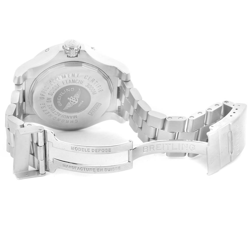 The image shows the back of the Breitling Avenger A17330 Men's Stainless Steel Yellow Dial A17330 Men's Stainless Steel Yellow Dial watch and its partially open metal bracelet clasp.