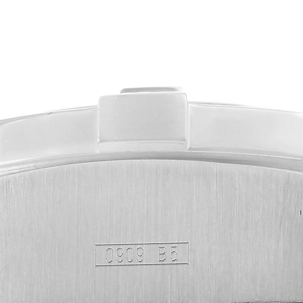 The image shows a close-up of the watch bezel and caseback of a Breitling Avenger A17330 Men's Stainless Steel Yellow Dial A17330 Men's Stainless Steel Yellow Dial model, with partial view of its serial number.