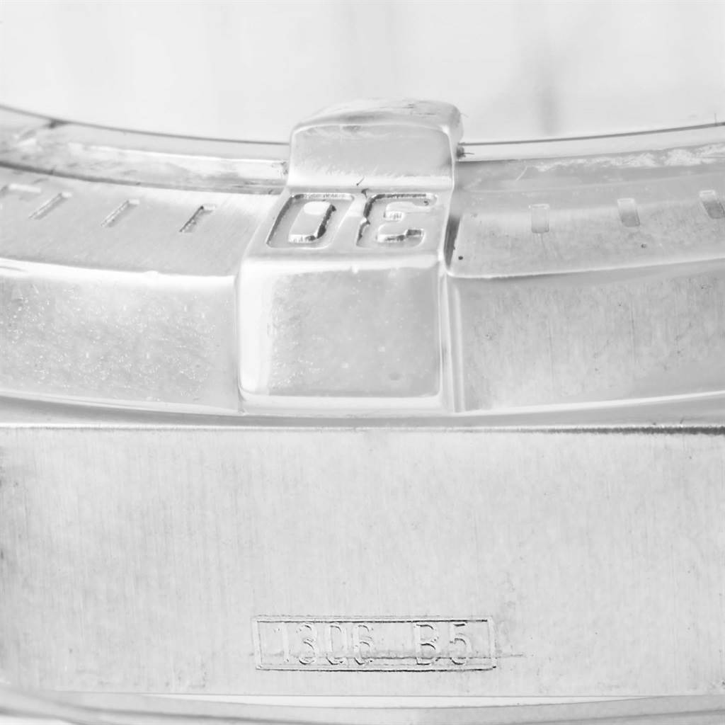 The image shows a close-up of the bezel and lugs of a Breitling Superocean A17390 Men's Stainless Steel Silver Dial A17390 Men's Stainless Steel Silver Dial watch, focused on the numbers and text detailing.